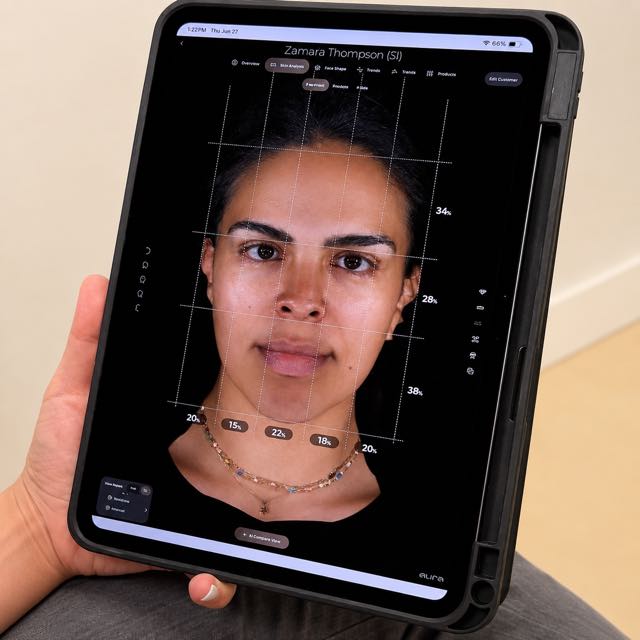 Aura Skin Analysis tablet showing facial measurement scan