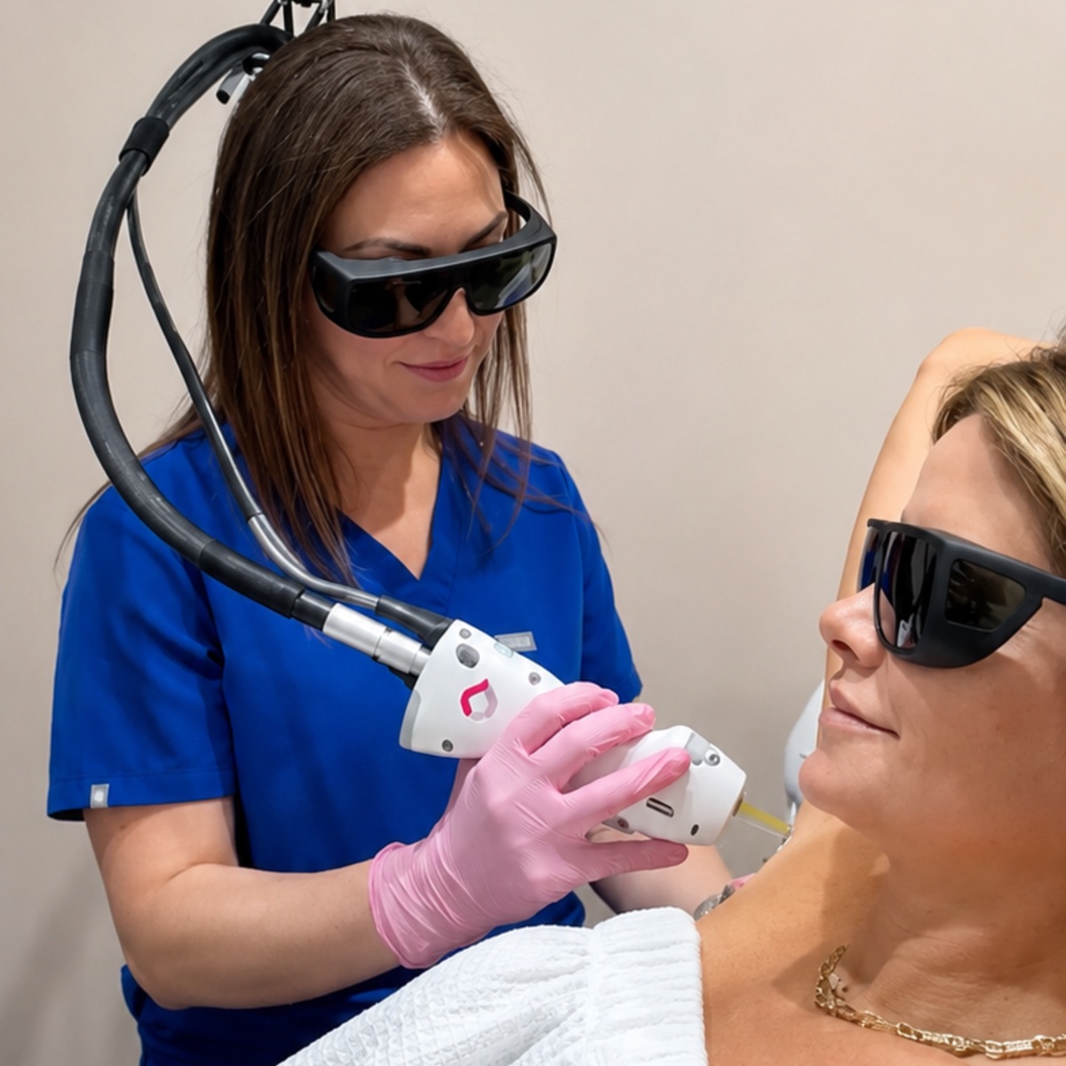 Corinne Aesthetics provider performing a GentleMax Pro Plus laser treatment
