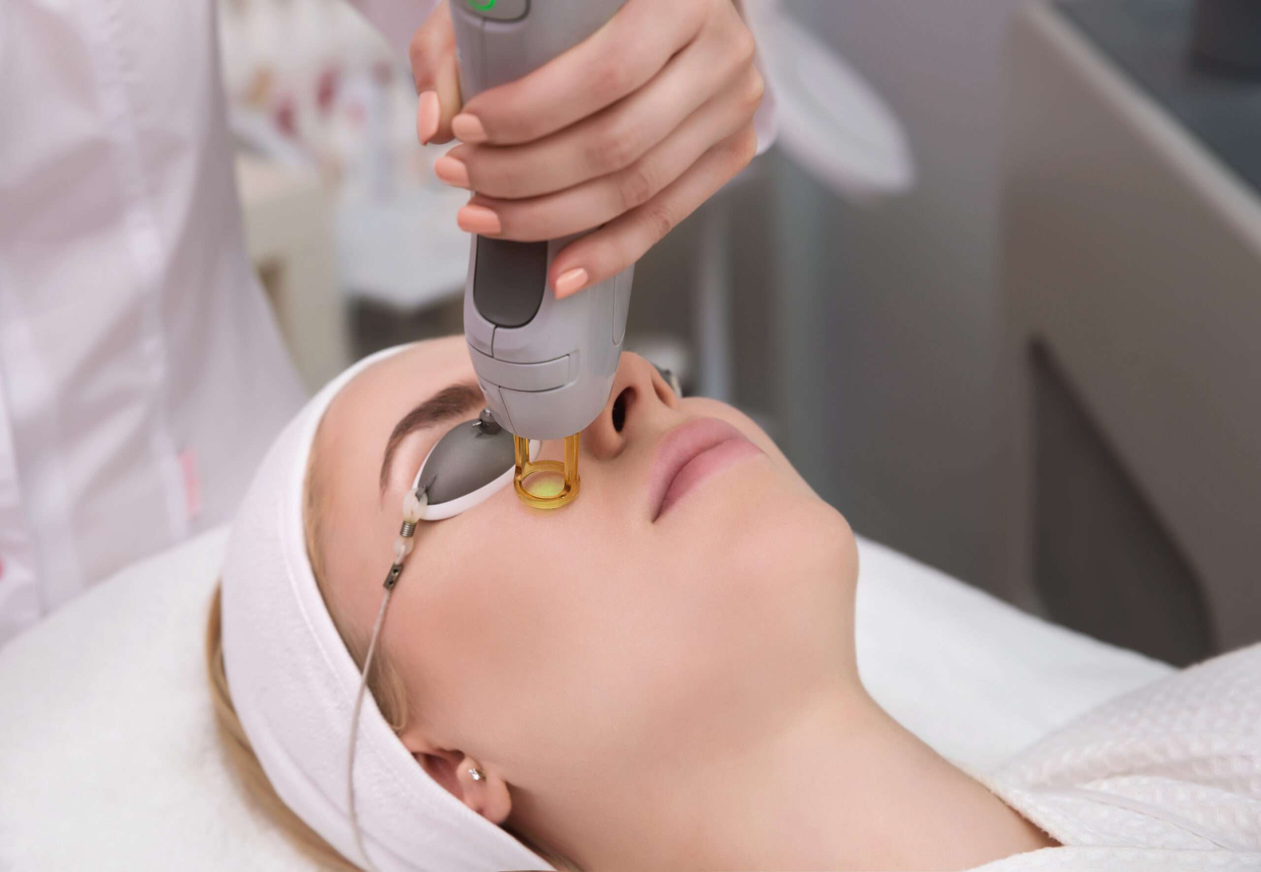 Corinne giving a client a laser facial treatment in Thousand Oaks to target pigmentation, wrinkles, and redness.